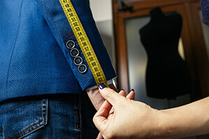 Photo of clothing being measured to indicate personalization