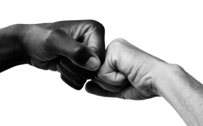 black and white image of two hands fist bumping