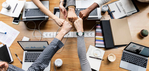 teamwork business colleagues giving a fist bump