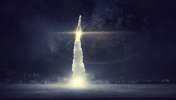 Photo illustration of a single rocket launching with glowing exhaust